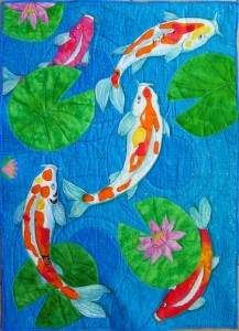 Koi Pond, raw edge applique hand-painted and commercial fabric. 40 x 42